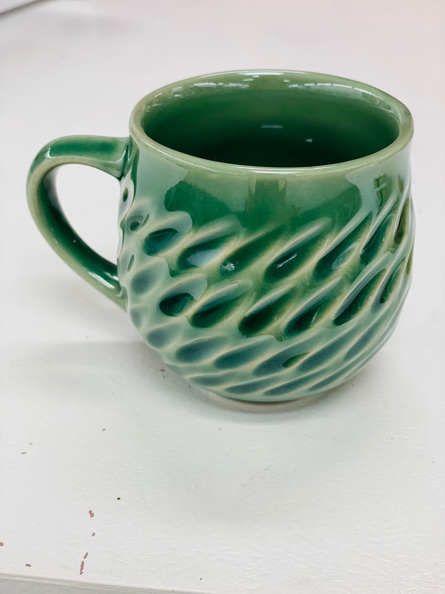 Small pottery mug green